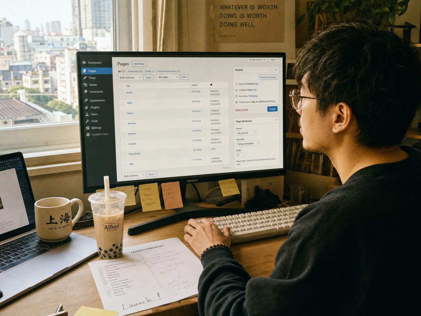 A Chinese web producer at a daylit studio desk, the calibrated monitor showing a CMS dashboard with a list of website pages and a publish panel.